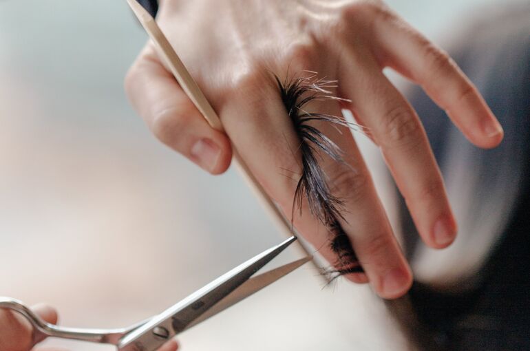 stylist-trimming-a-woman-s-hair